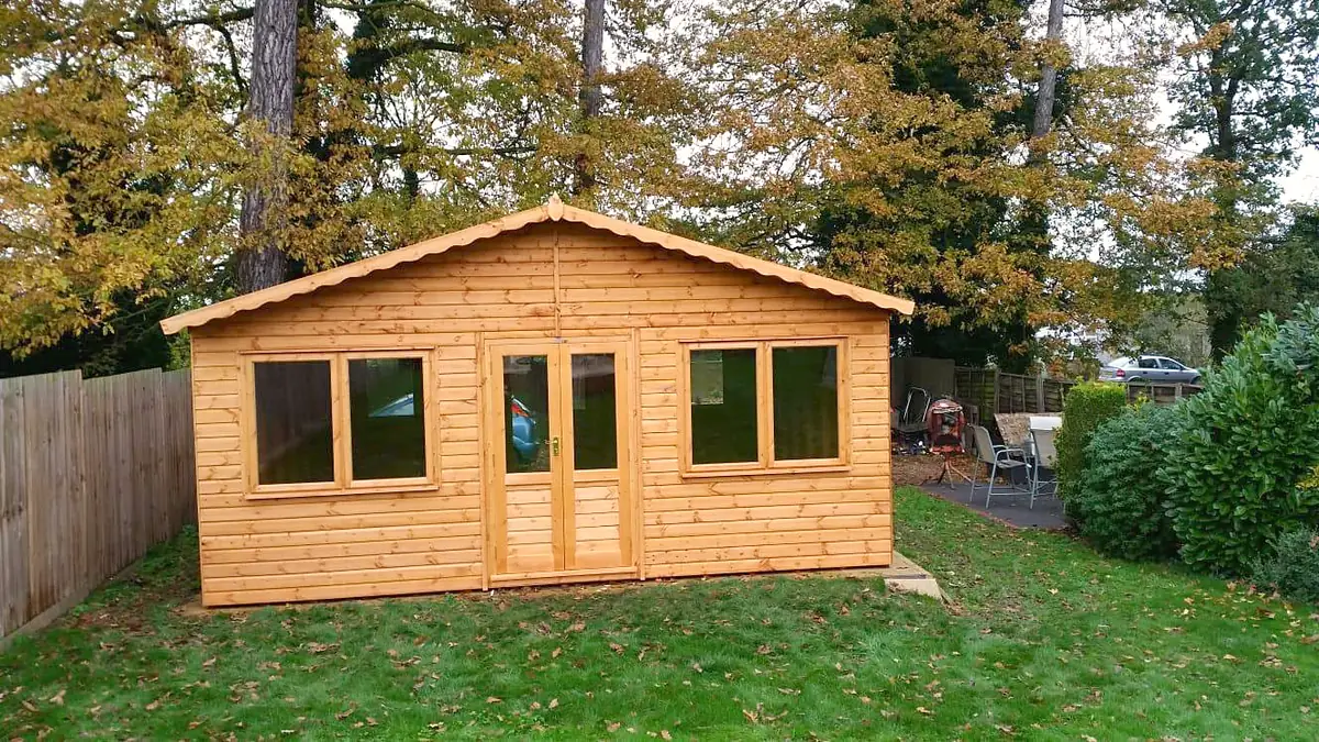 Long apex roof garden office with full-length windows