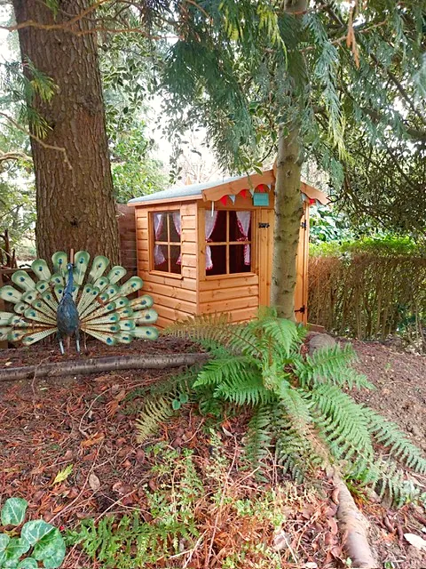 Children's playhouse with a door and front window