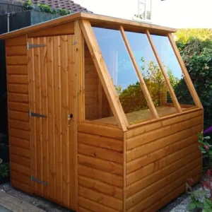 Garden potting shed with a glazed sloping roof