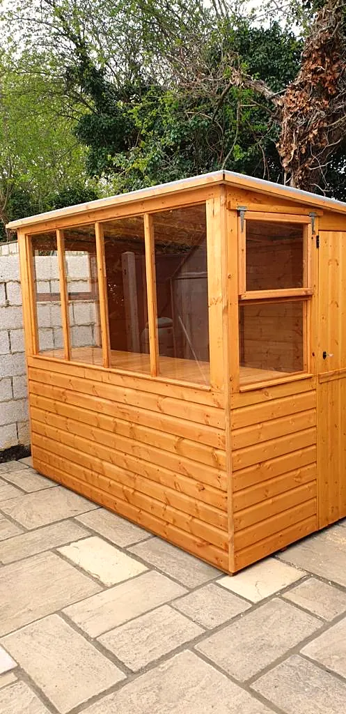 Garden potting shed with toughened glass windows