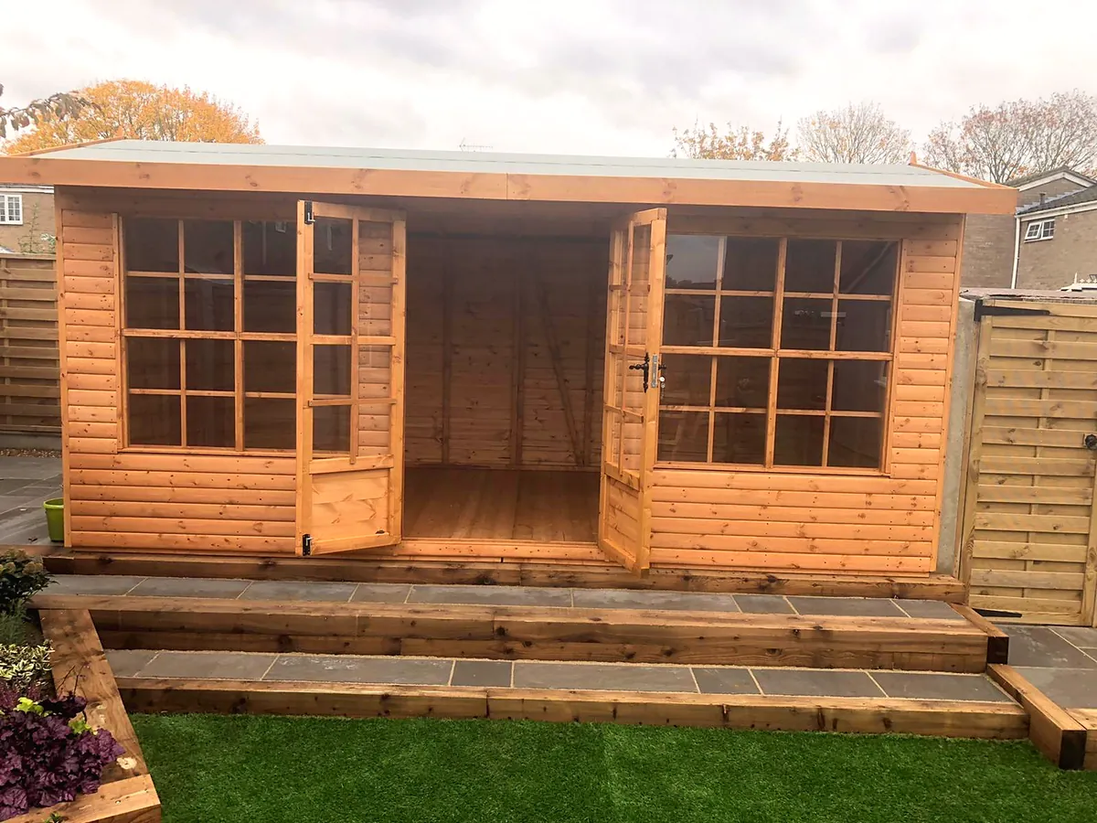 Pent roof summer house with glazed doors and windows