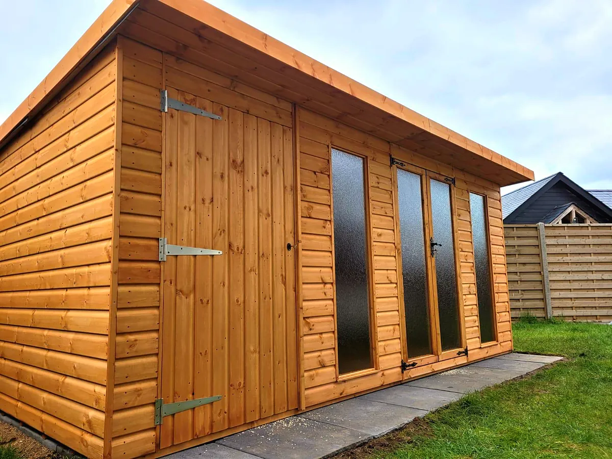 Pent roof summer house with an attached shed