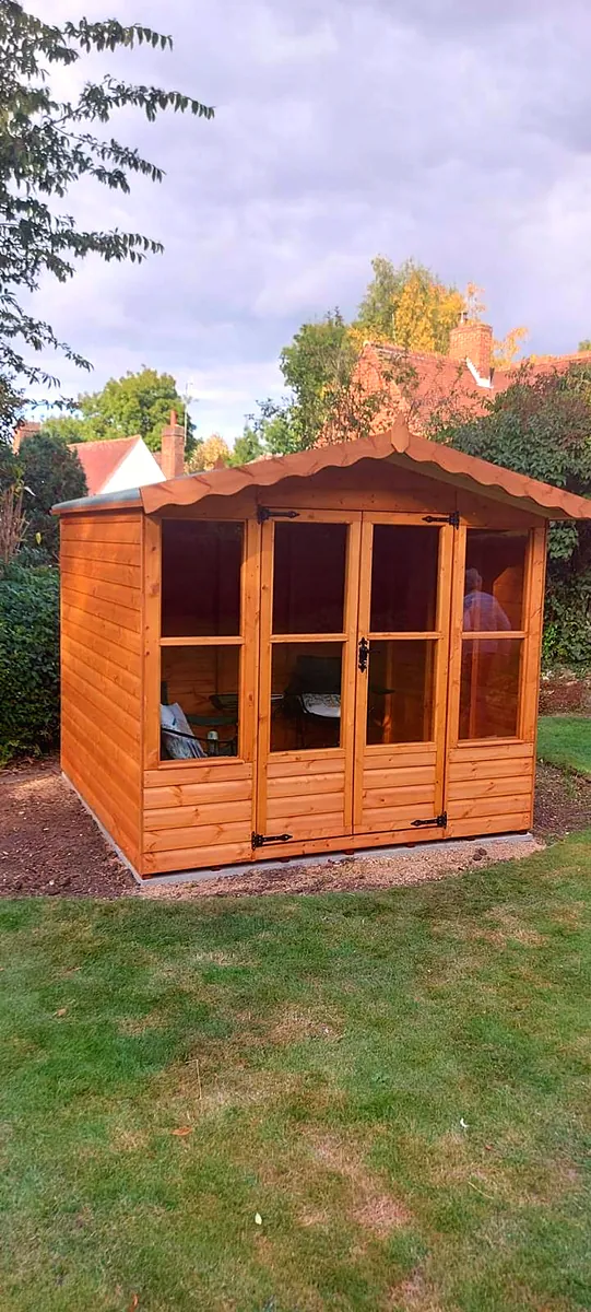 Apex roof summer house with a small veranda step
