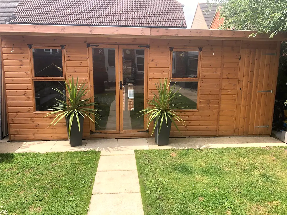 Pent roof summer house with glazed double doors