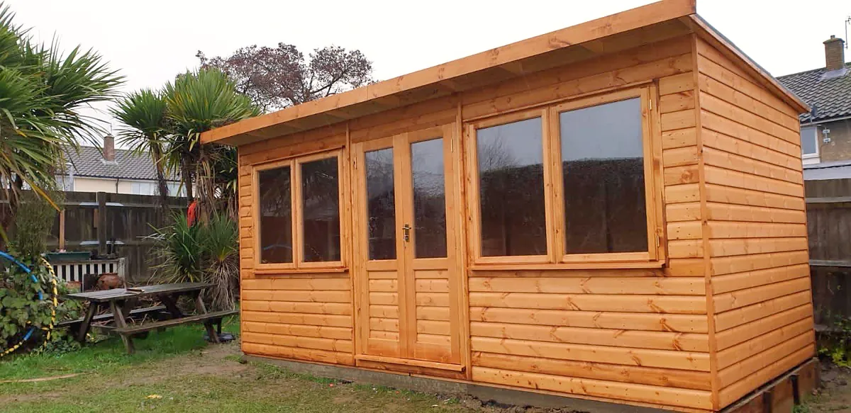 Pent roof garden office with glazed doors and windows
