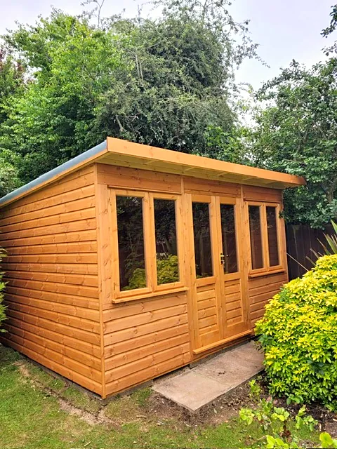 Pent roof garden office with a single door