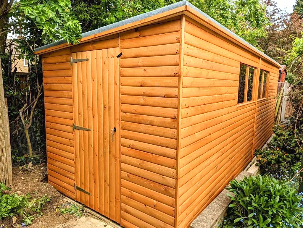 Pent roof garden shed with windows along the side
