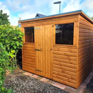 Pent roof garden shed with a timber door and window