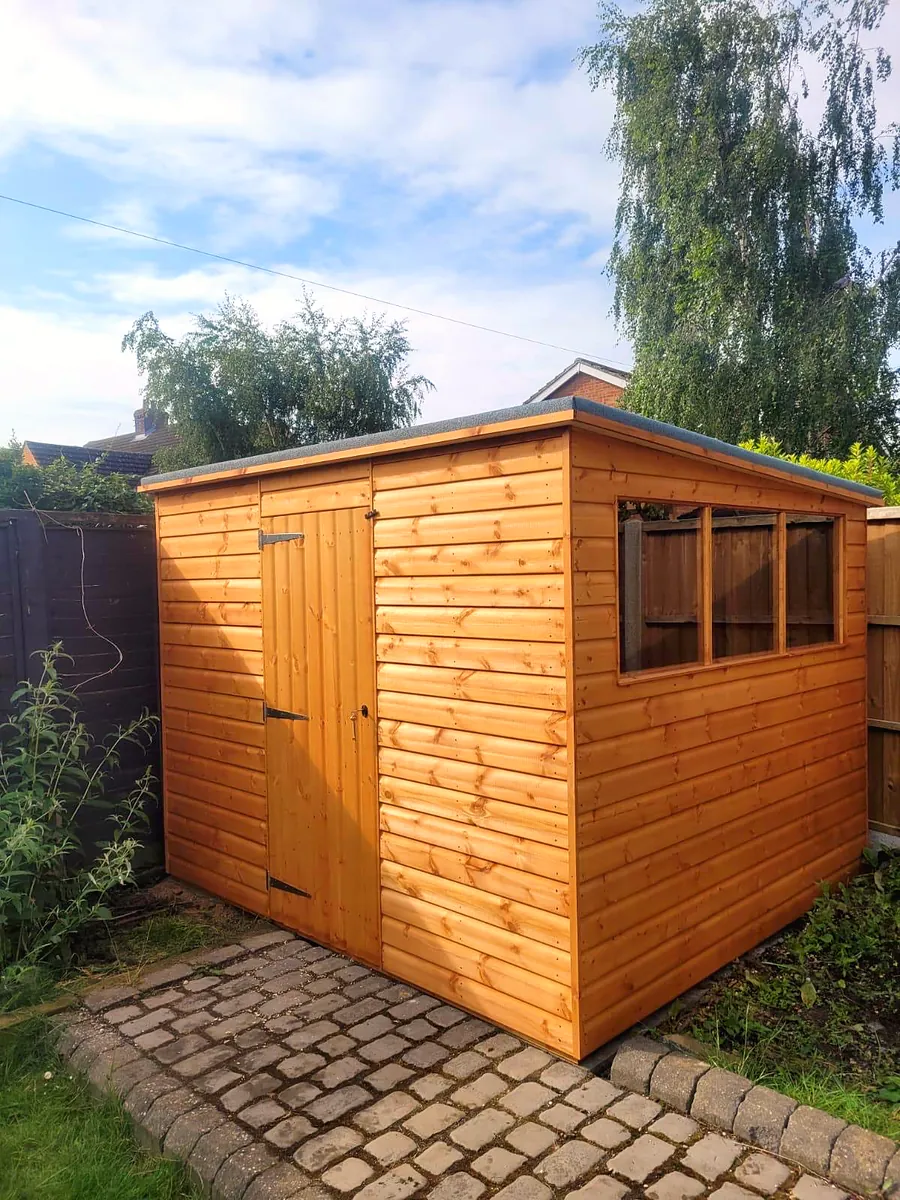 Pent roof garden shed with front windows