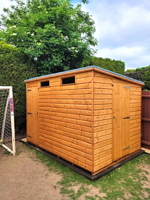 Pent roof garden shed with a single door