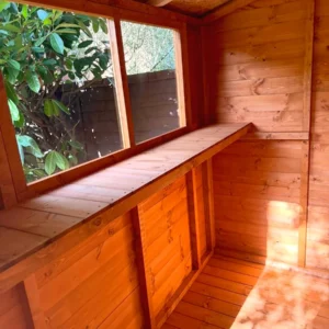 Timber work bench under the window inside a shed
