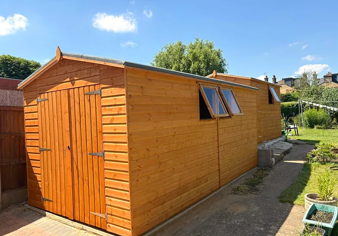 Garden workshop with double doors and windows