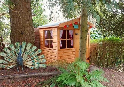 Children's playhouse with a door and front window