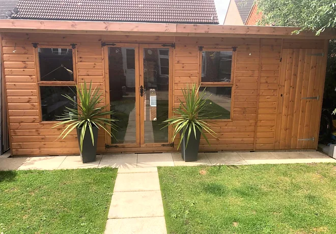 Pent roof summer house with glazed double doors
